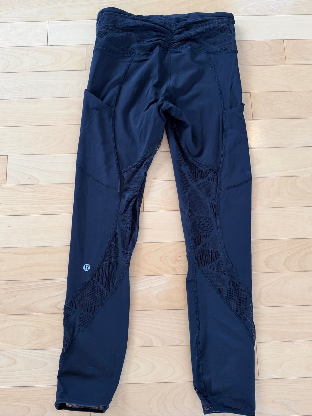 Lululemon black cropped leggings with mesh on waistband and legs, side pockets